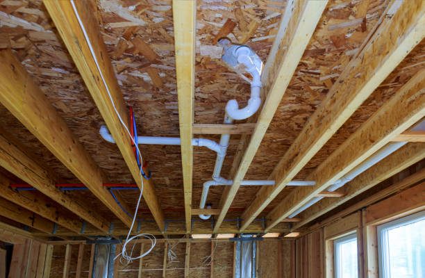 Waste PVC pipe drainage system inside building, piping on the ceiling of home Service de plomberie - Bordeaux Confort Énergie - BCE